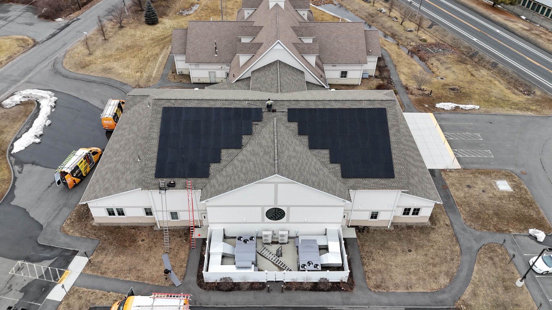 Solar panel installation on commercial building roof.