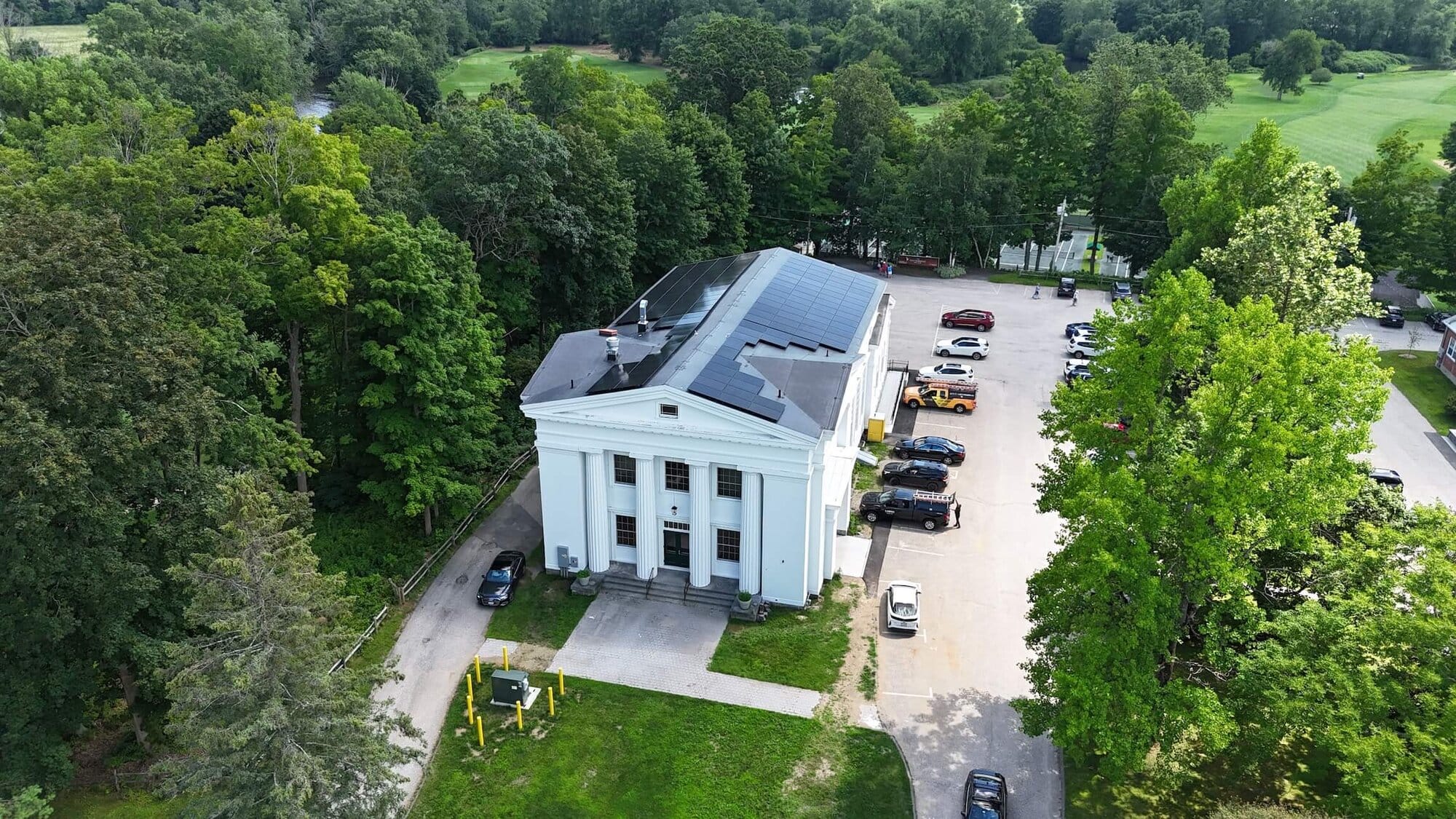 Solar power system on white courthouse building, Valley Solar solar energy installation.