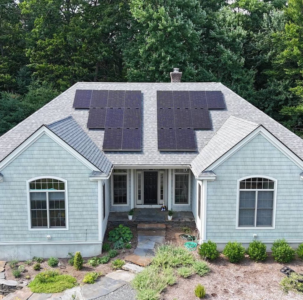 Solar panel installation on residential roof for clean energy efficiency.