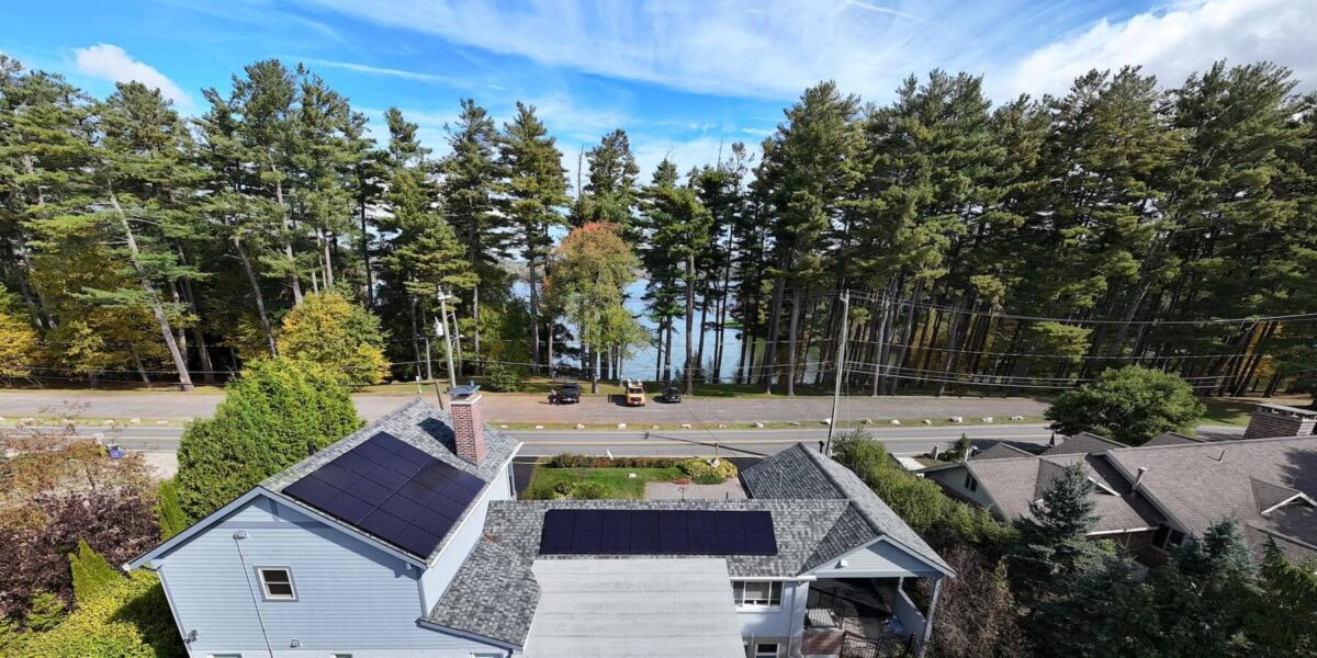 Solar panel system on residential roof in valley setting, energy-efficient, eco-friendly home, renewable energy, solar power, sustainable living.