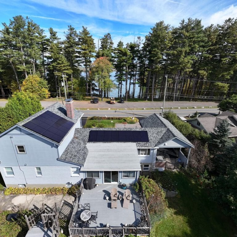 Solar panel system on residential roof in valley setting, energy-efficient, eco-friendly home, renewable energy, solar power, sustainable living.