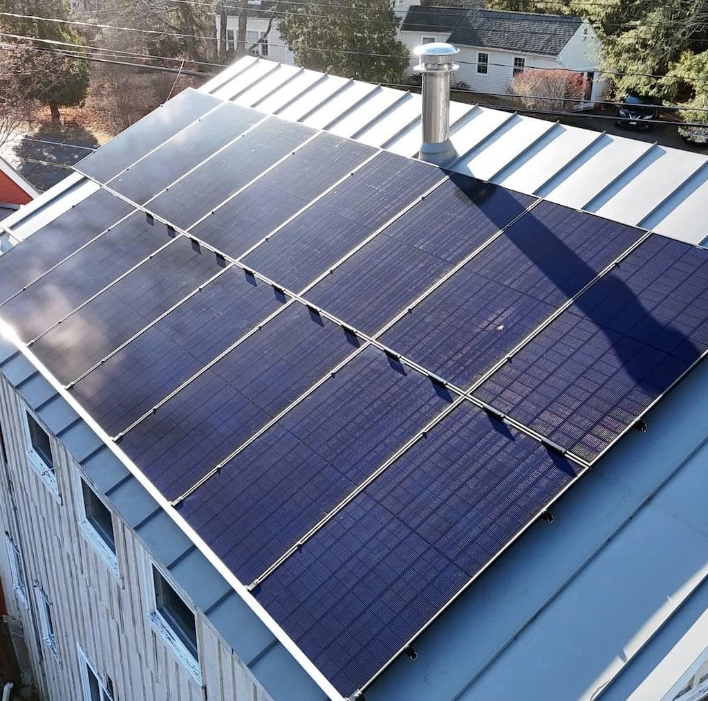 Solar power roof panels installed on a residential building for clean energy.
