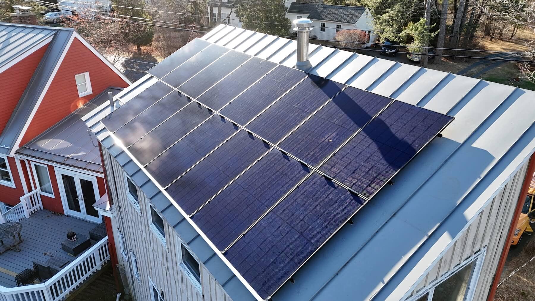 Solar power roof panels installed on a residential building for clean energy.