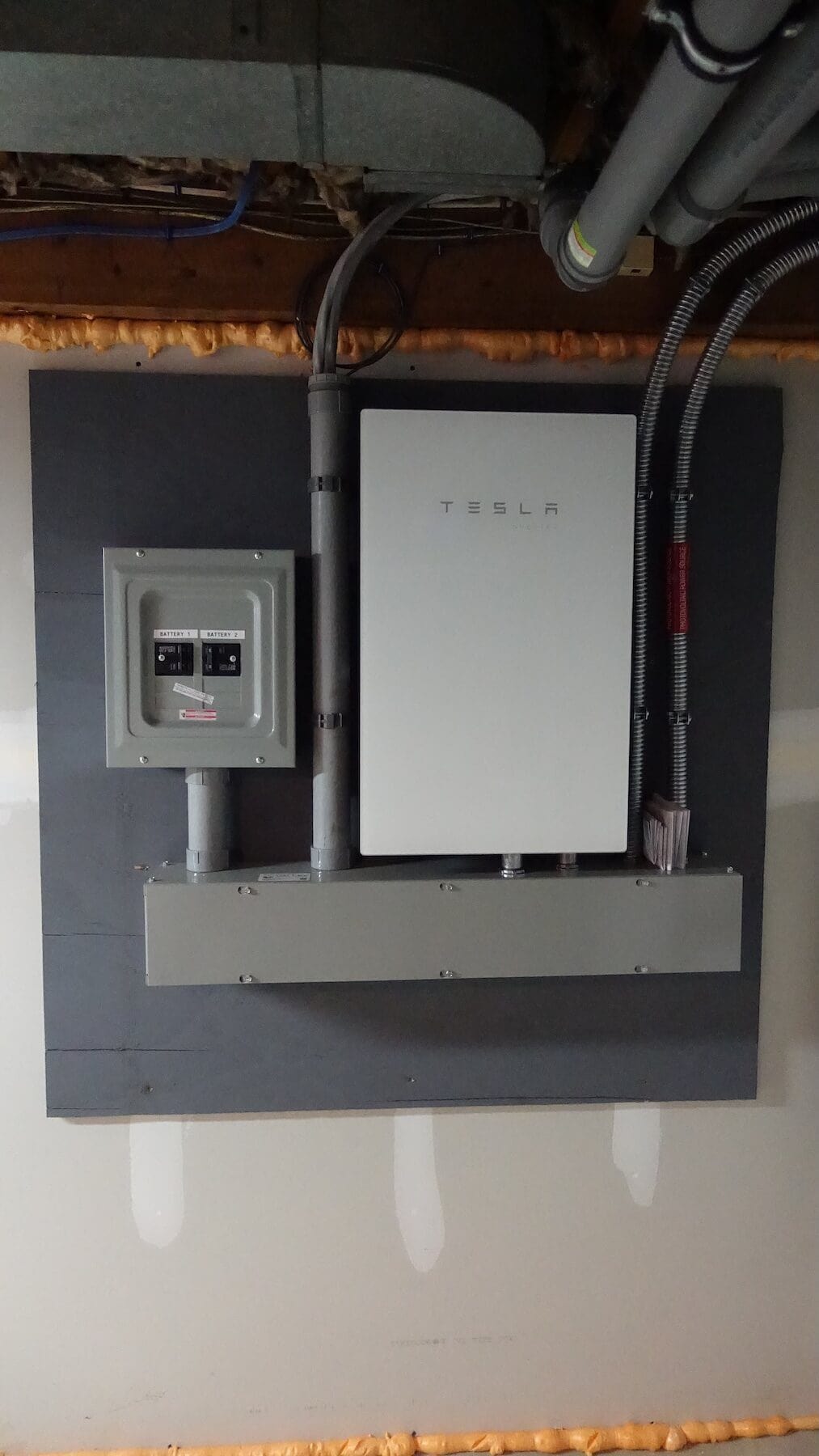 Tesla solar inverter and electrical panel for solar power system installation.