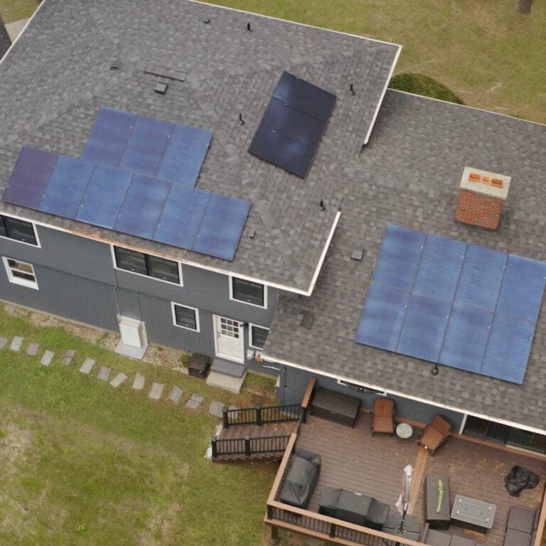 Solar panel installation on house roof for renewable energy.